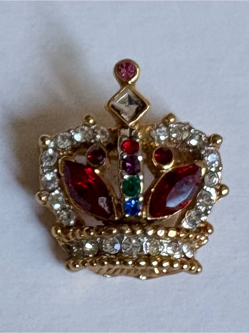 Gold-tone metal crown brooch with rhinestones and colored glass stones
